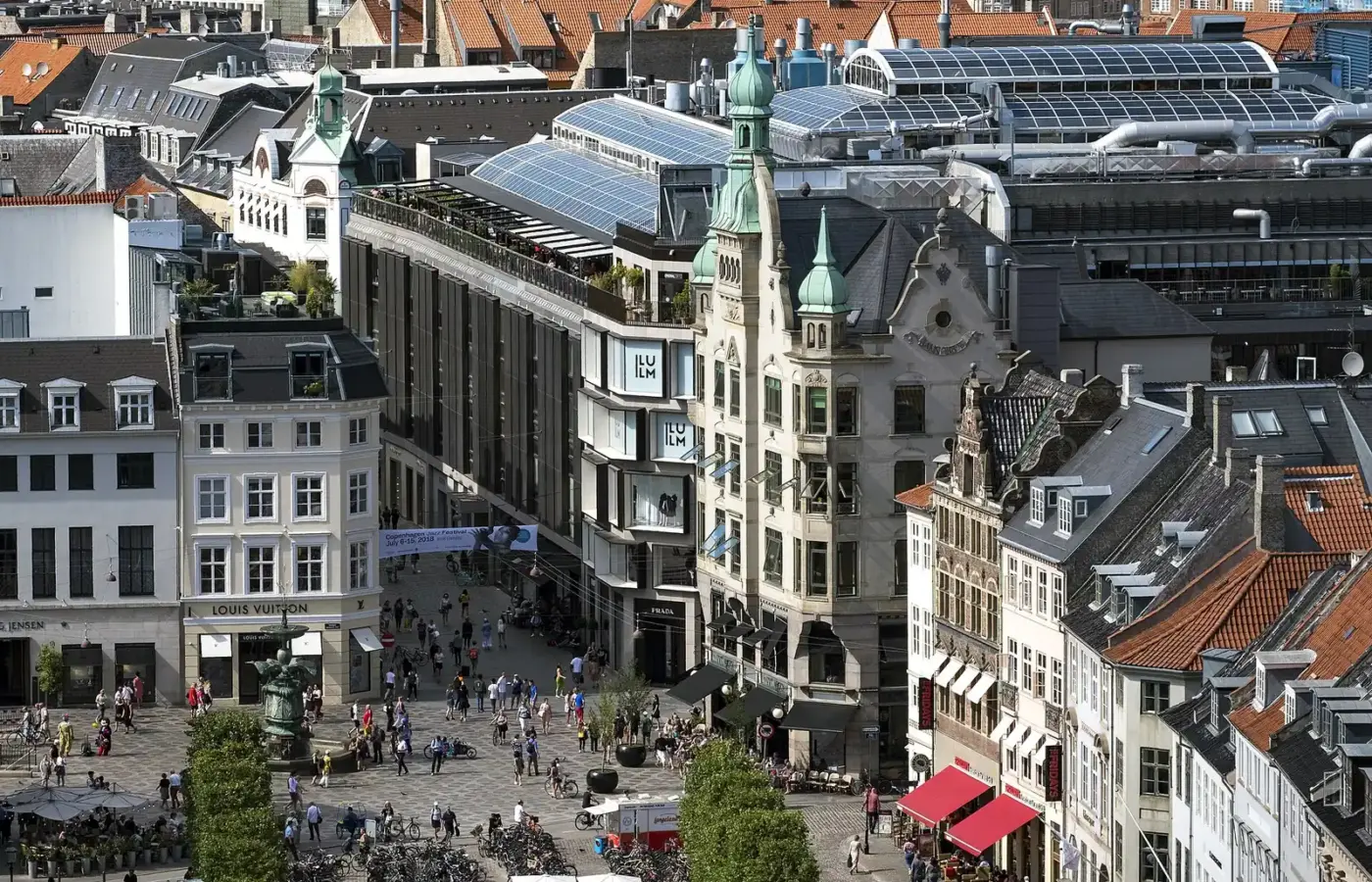 Amagertorv and Stroget from above, with the ILLUM department store, luxury shops and the Stork Fountain
