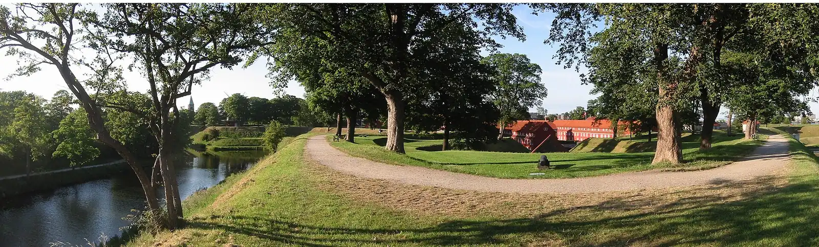 The gravel path along the top of Kastellet's ramparts, curving round a bastion above the moat