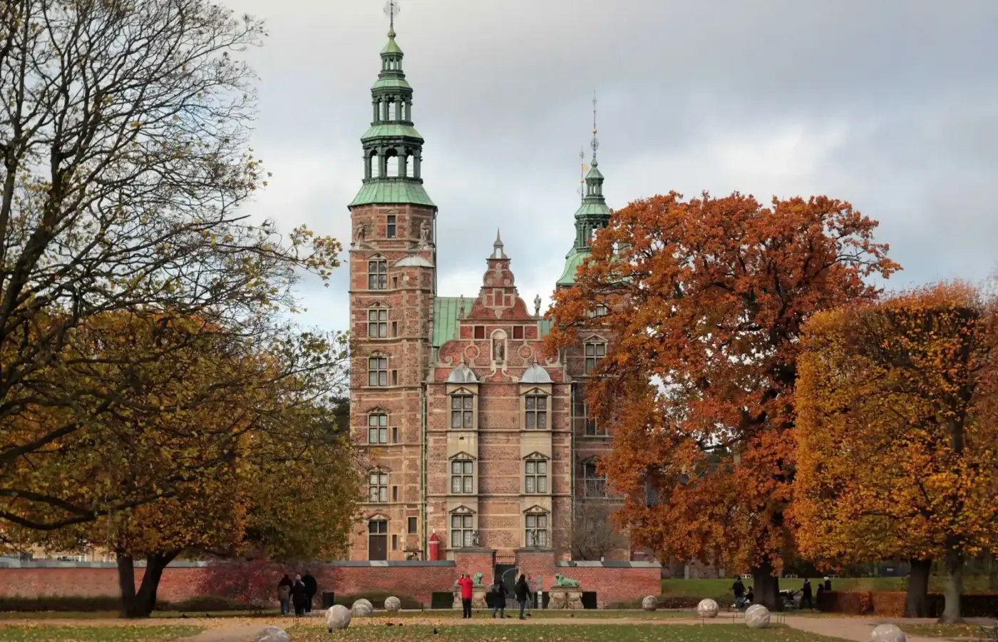 Rosenborg Castle seen across Kongens Have with the trees in autumn colours